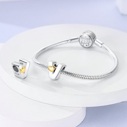 Zlatý stříbrný korálek Srdce s písmenem V